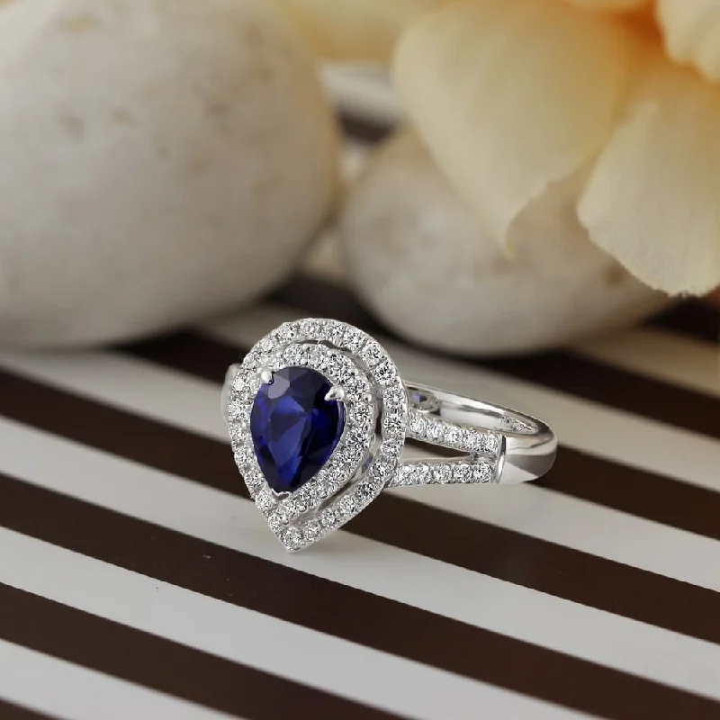 Rings with vintage claw prongs for elegance -Auriya 1 3/8ct Pear Shape Blue Sapphire Halo Diamond Engagement Ring 5/8ct TDW 18k Gold