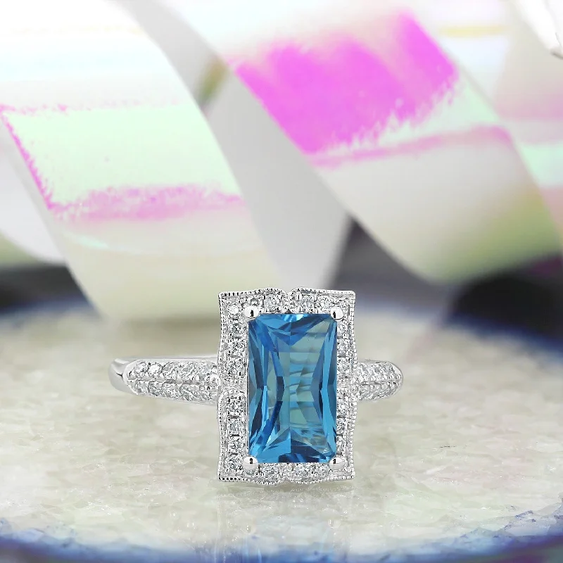 Rings with rough sapphire for rugged chic -Auriya Vintage 2 5/8ct Emerald-cut Swiss-Blue Topaz and Halo Diamond Engagement Ring 1/3ctw 14k Gold