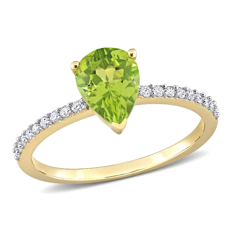 Rings with tourmaline gems for bold hues -Miadora 1 1/7ct TGW Pear Shape Peridot and 1/7ct TDW Diamond Ring in 14k Yellow Gold