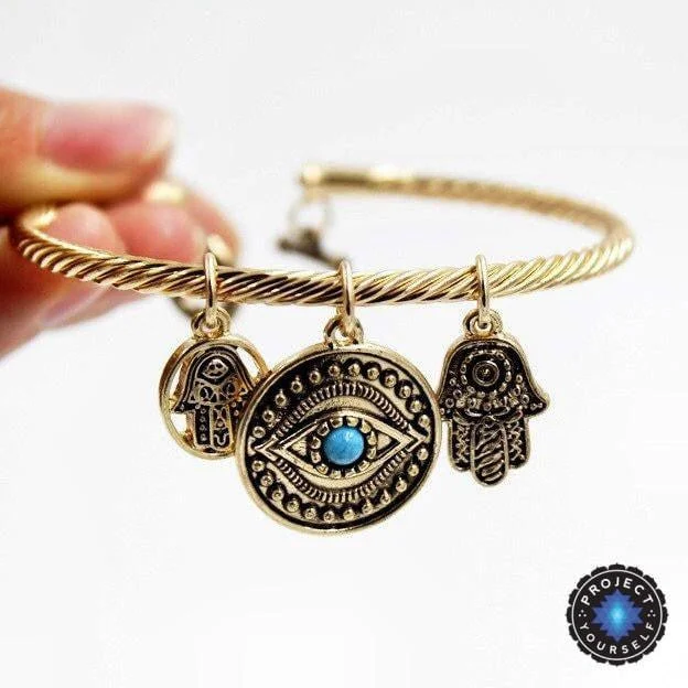 Best bangle bracelets with cubic zirconia inlays for affordable elegance and sparkle-Charming Hand of Fatima Blue Evil Eye Bracelet