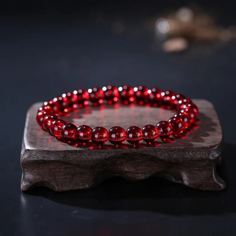 Chunky bangle bracelets with metallic finishes for a bold and statement-making look-Manifesting Miracle Garnet Bracelet