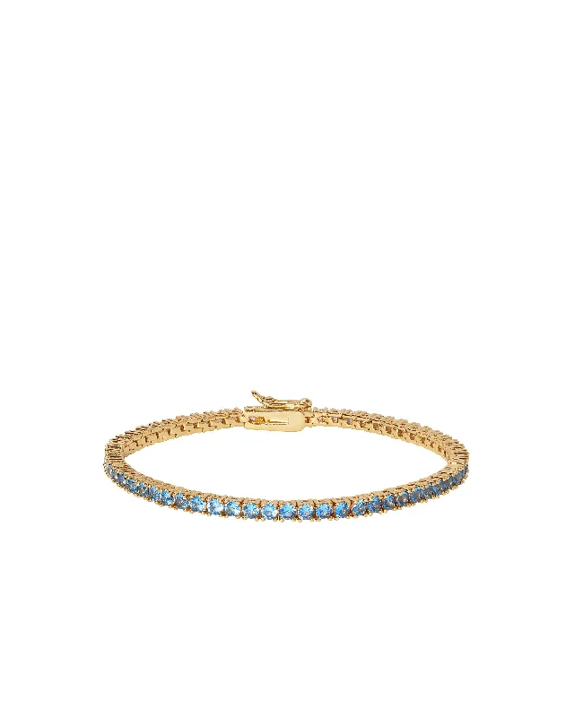 Chunky bangle bracelets with metallic finishes for a bold and statement-making look-Rally Bracelet in Sapphire