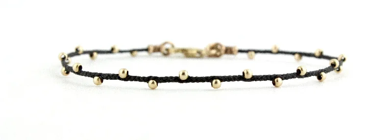 Chunky bangle bracelets with metallic finishes for a bold and statement-making look-Teenie Less is More Bracelet in Gold